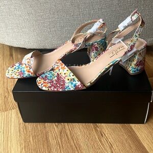 Nanette Lepore “Clarissa” style heel in ivory floral pattern.